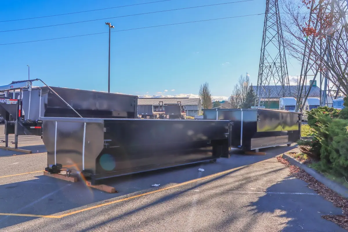 Roll-off dumpster ready for waste disposal at job site for Demolition Dumpster Rental in Garden City